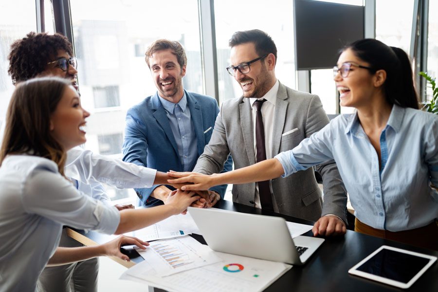 Commercial Umbrella Insurance - Co Workers Cheering Over a Deal