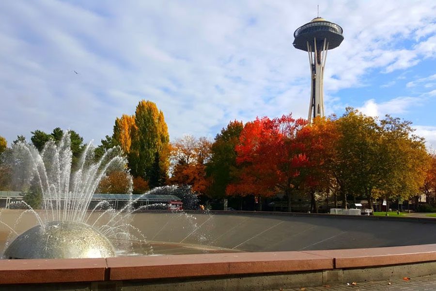 About Our Agency - View of Space Needle Monument in Seattle Washington with Views of Fall Foliage and a Blue Sky
